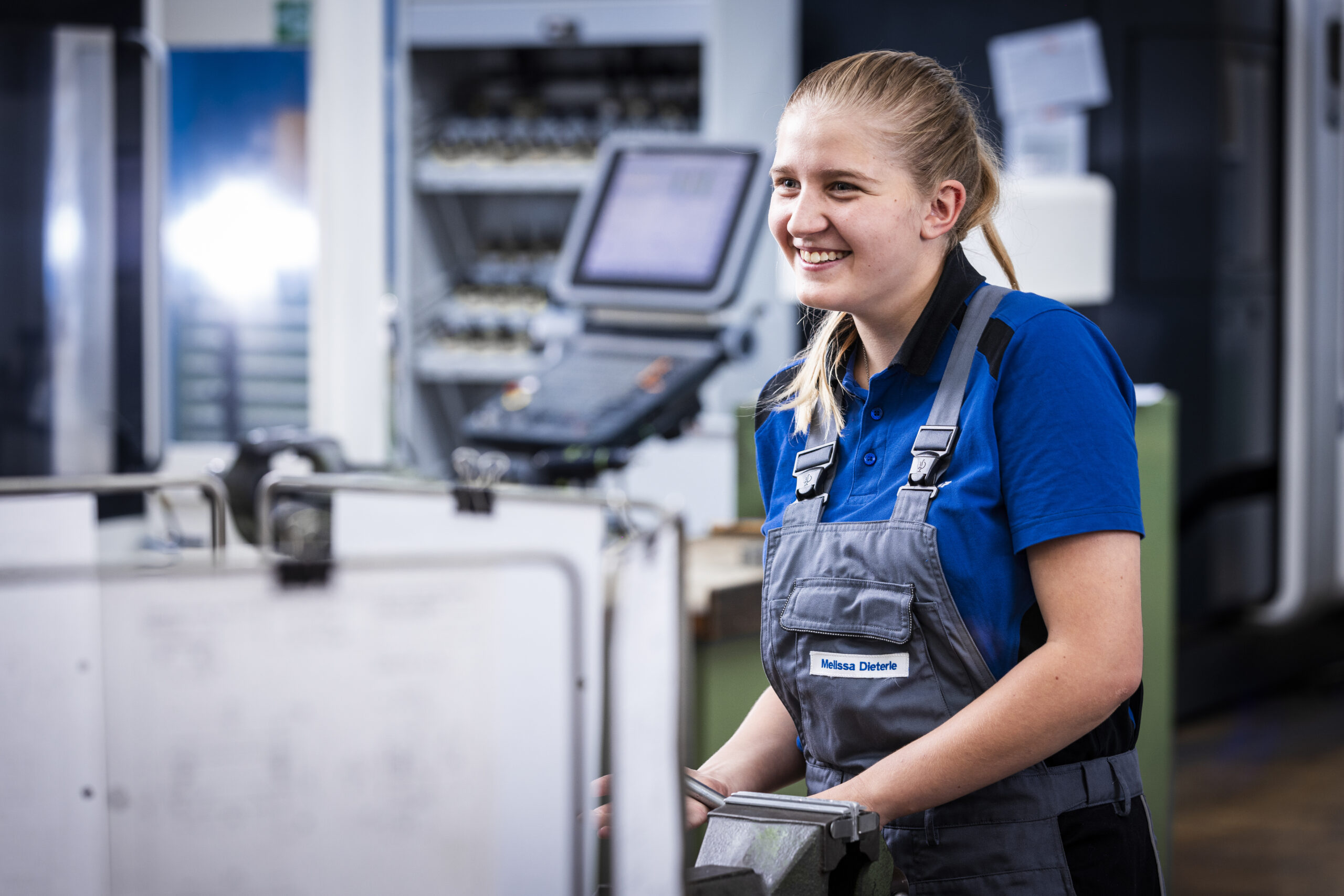Apprentice at a machine in the workshop