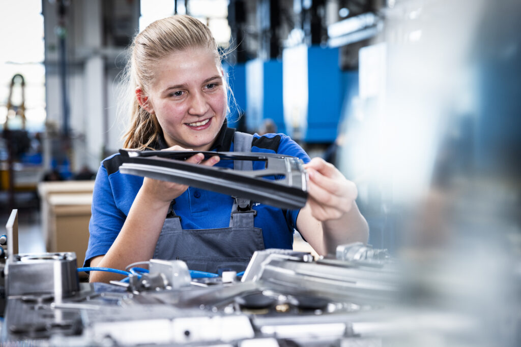 Apprentice inspecting a sealing profile on a system